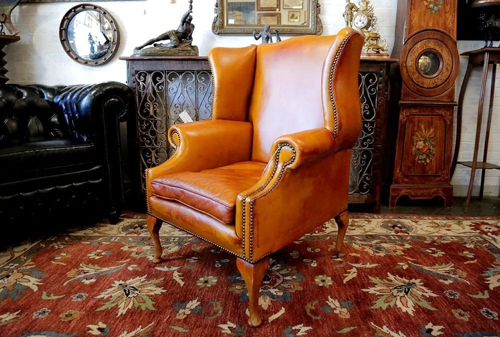 Add an antique or worn-leather chair in the corner. 