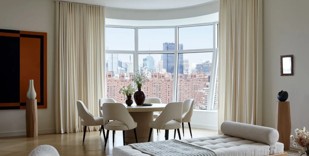 Hang curtains floor-to-ceiling, not window-to-windowsill