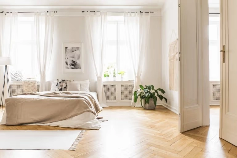 Hang sheer curtains floor-to-ceiling
