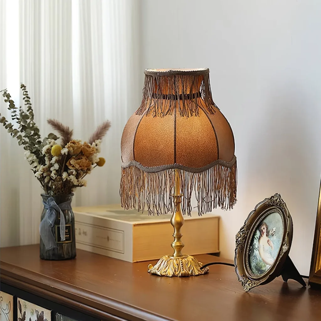 Use brass or bronze table lamps with vintage shades. 