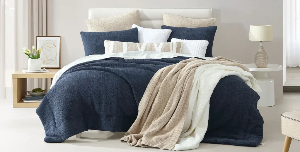 Drape a silky or knit throw at the foot of the bed