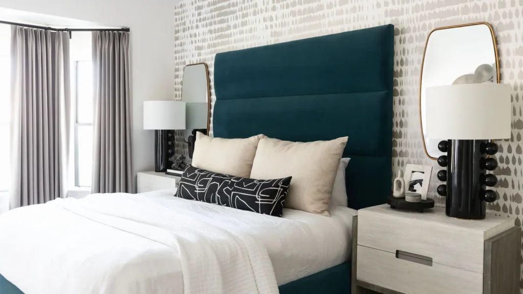 Hang one large mirror perpendicular to your window, not opposite the bed.