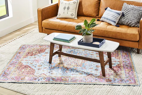 Layer two rugs at different sizes. 